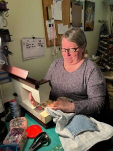 Judi Fischer at work in her sewing studio. 
