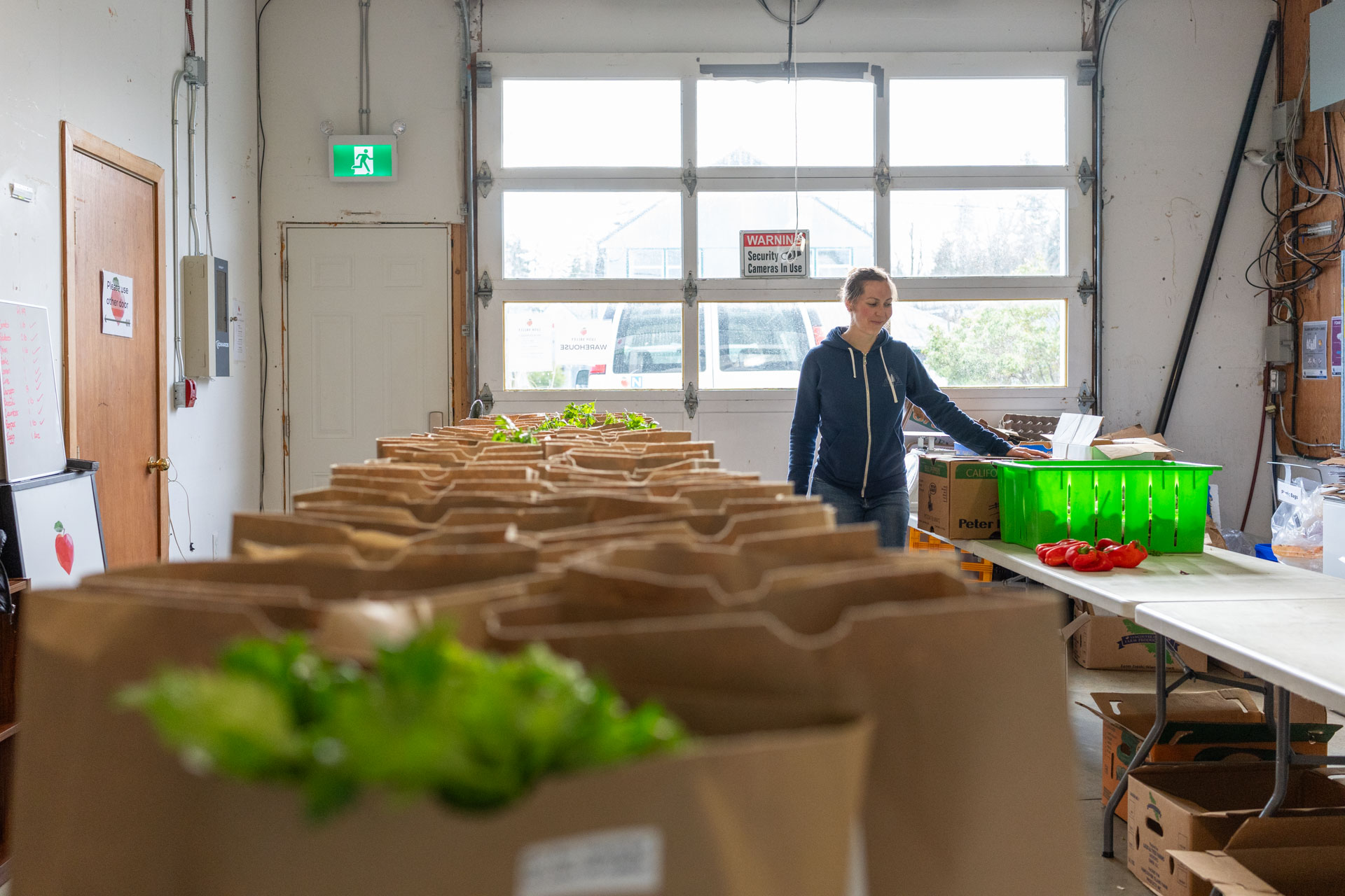 dozens of food boxes, filled with Comox Valley produce at the LUSH valley warehouse.