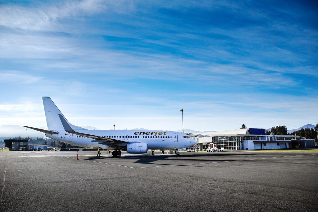 An Enerjet plane sits outside the Nanaimo Airport Building.
