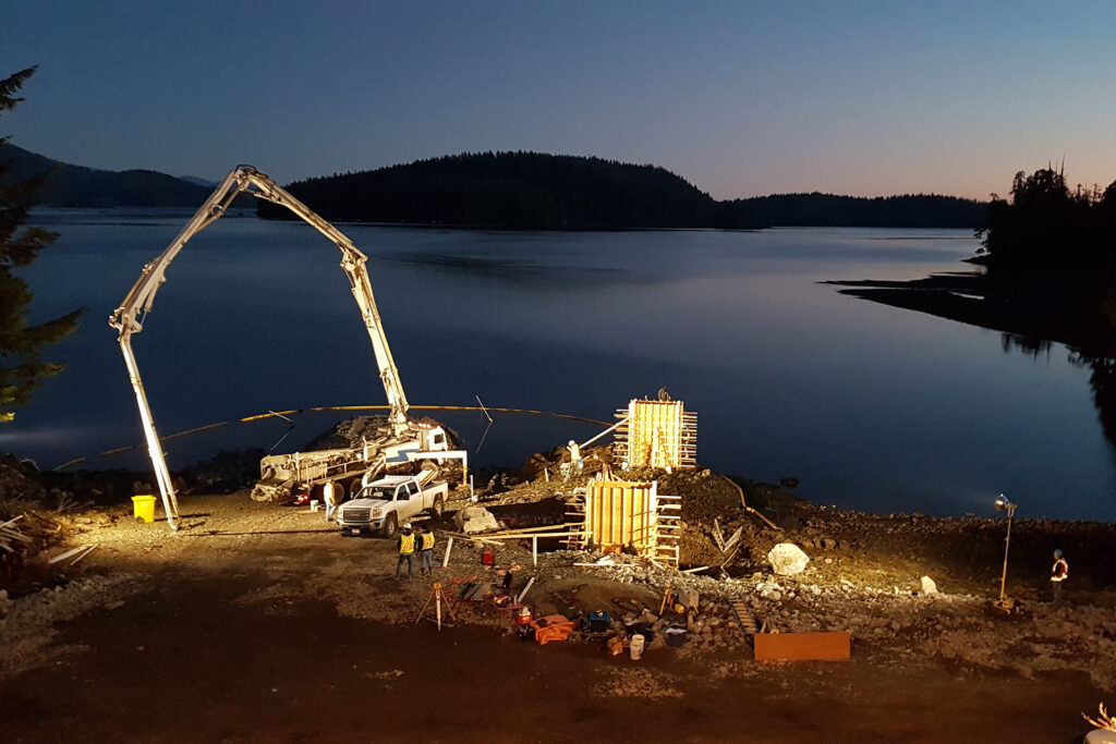 While under construction, the Secret beach Marina is illuminated by flood lights.