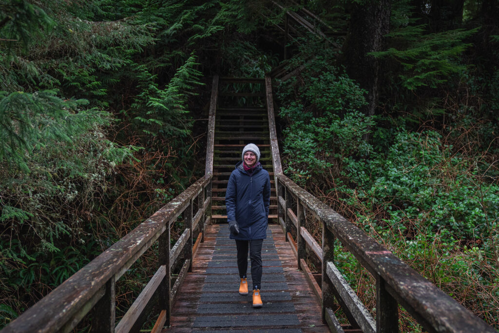 A woman walks the Wild Pacific Trail in Ucluelet on a wet winter day.
